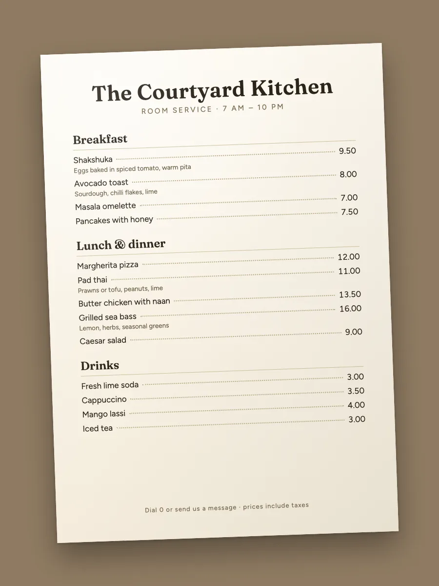 A photo of a printed menu: The Courtyard Kitchen, with breakfast, lunch and dinner, and drinks